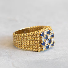 Load image into Gallery viewer, Angled view showing the square checkerboard face and the beaded texture of the gold setting.