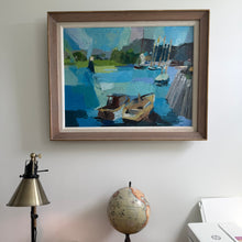 Load image into Gallery viewer, Framed painting of a harbor scene on a wall with a lamp and globe below.