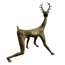 Load image into Gallery viewer, Side profile of bronze sculpture showing elongated limbs and antlered head.