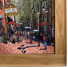 Load image into Gallery viewer, Close-up detail of Randy Smith’s Earth Day showing pedestrians along Charlottesville’s Downtown Mall, textured brushwork, and the wide natural oak frame surrounding the painting.