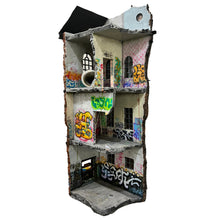 Load image into Gallery viewer, Interior-facing view of multi-level structure showing painted rooms, windows, and graffiti details.