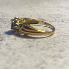 Load image into Gallery viewer, Side view of 14K gold emerald and diamond ring showing setting height and band detail

