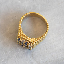Load image into Gallery viewer, Top-down view of the entire 18k gold ring showing the band's width and the checkerboard stone layout.
