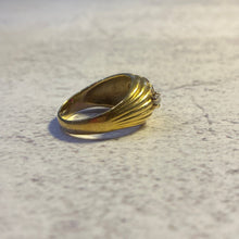 Load image into Gallery viewer, Side profile view showing the smooth polished 18k gold band and the flush-mount ruby setting.
