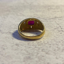 Load image into Gallery viewer, View of the interior setting of the 18k gold ruby ring showing the open-back basket.
