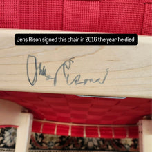 Load image into Gallery viewer, Close-up of Jens Risom's signature on the underside of the chair's maple frame.
