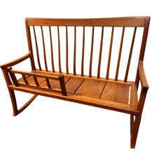 Load image into Gallery viewer, Angled view of wooden rocking bench showing side profile, rocker base, and slatted construction with refined joinery and minimalist design.
