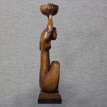 Load image into Gallery viewer, Side profile of figure holding raised bowl overhead.
