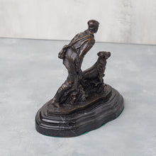Load image into Gallery viewer, Rear three-quarter view of bronze hunter and dog, showing sculptural depth and composition.
