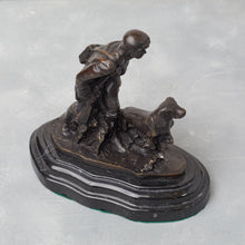 Load image into Gallery viewer, Side view of bronze hunter and dog, showing profile and stance.
