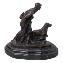 Load image into Gallery viewer, Bronze sculpture of a hunter with dog on a shaped base with dark patina.
