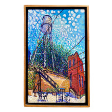 Load image into Gallery viewer, Framed oil on board painting featuring a water tower and surrounding area in a colorful depiction.
